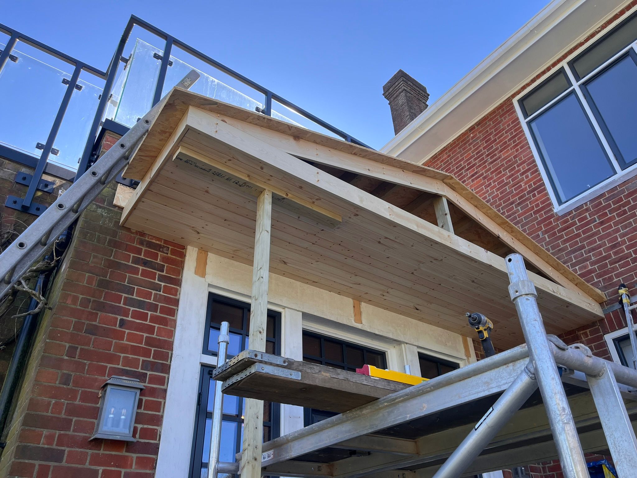 Structural timber framing over extension